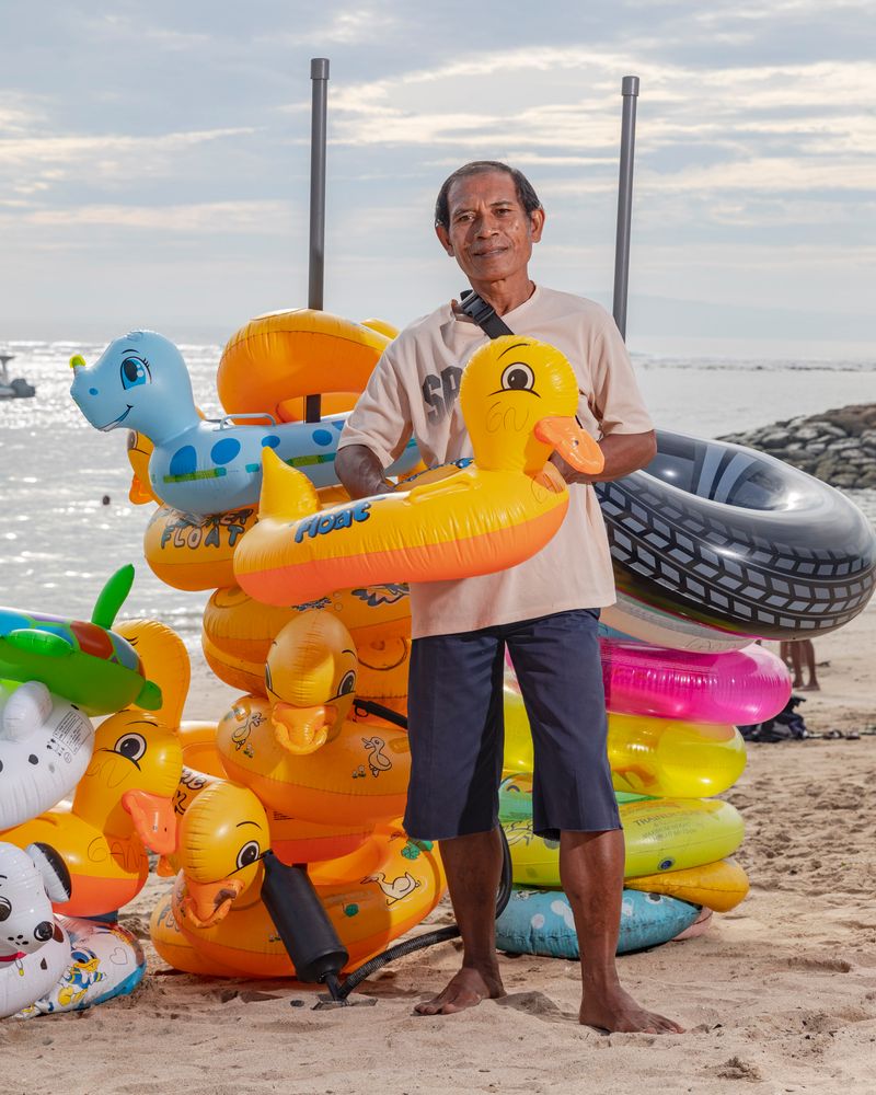 © Nyimas Laula - Ketut Sudiartana, 58, rents floaties at Sanur Beach in Bali.