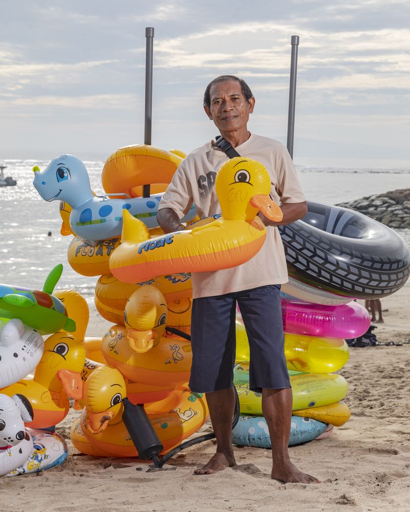 © Nyimas Laula - Ketut Sudiartana, 58, rents floaties at Sanur Beach in Bali.