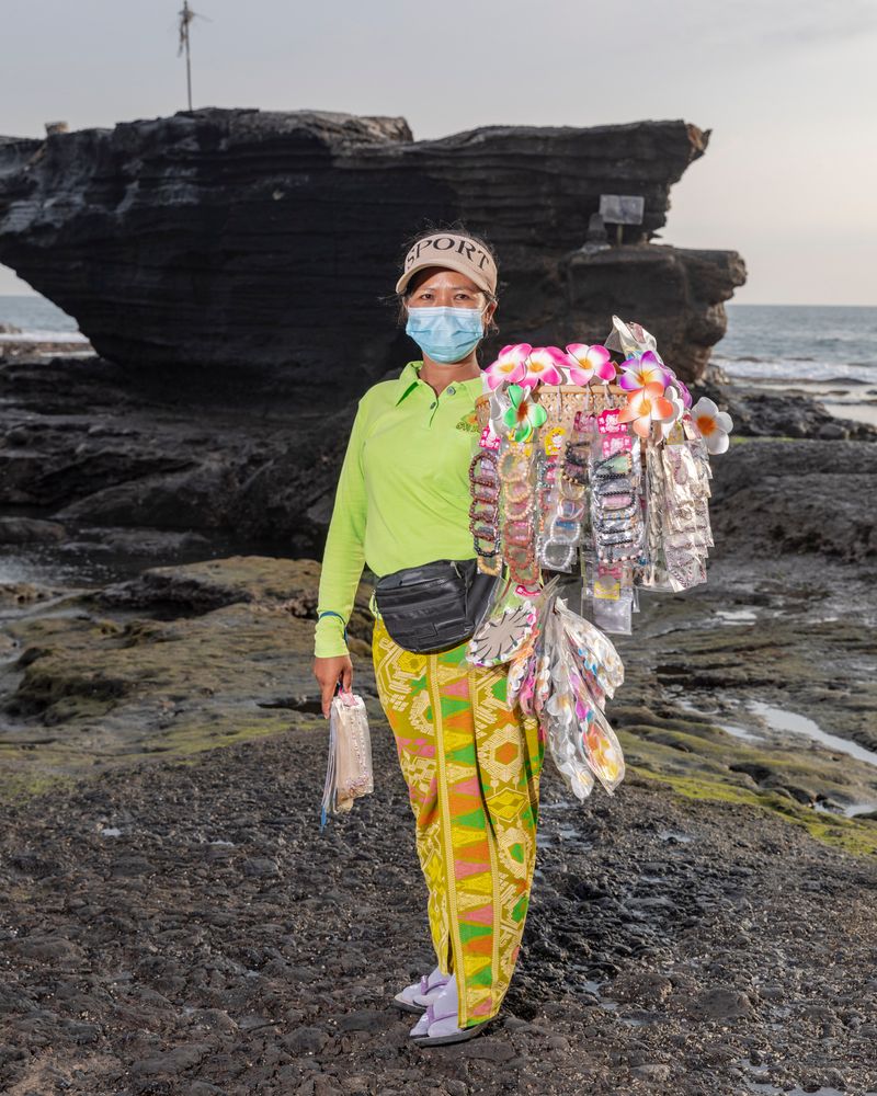 © Nyimas Laula - Wayan Yuli, 30, sells souvenirs and hair clips at Tanah Lot, Bali, Indonesia.