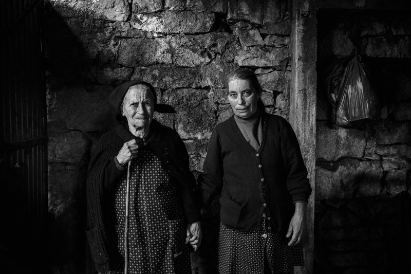 © Ricardo Lopes - Maria da Piedade, 90, with her daughter, Maria Olaia Dias, 61, Leiria, Portugal, January 13, 2019.