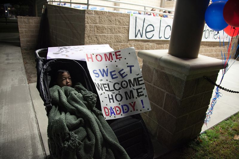 © Arin Yoon - Teo waits to see his dad after a nine-month deployment in 2018, Fort Stewart, Georgia.
