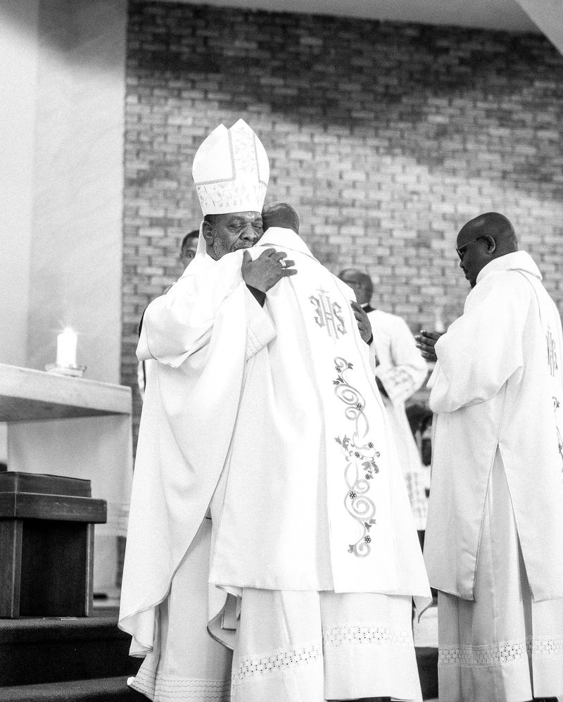 © Cole Ndelu - The ordination is complete and the bishop embraces the newly ordained deacons