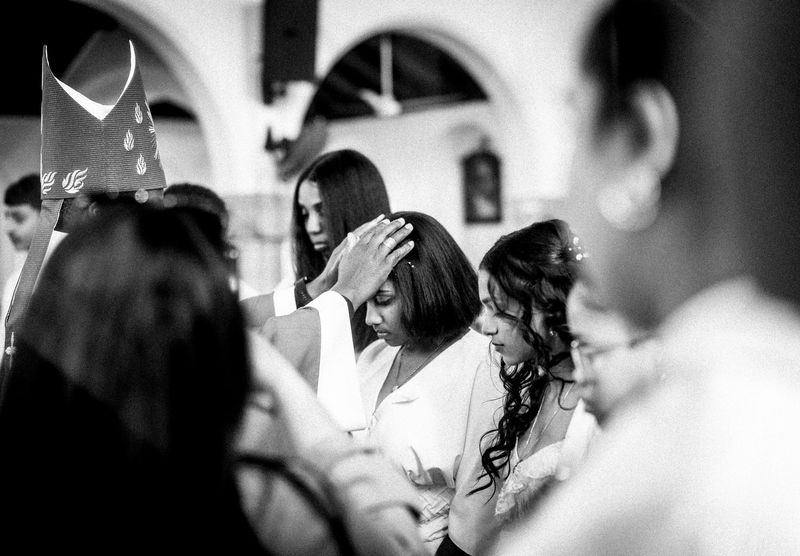 © Cole Ndelu - The laying of the hands - the bishop blesses on of the confirmation candidates.