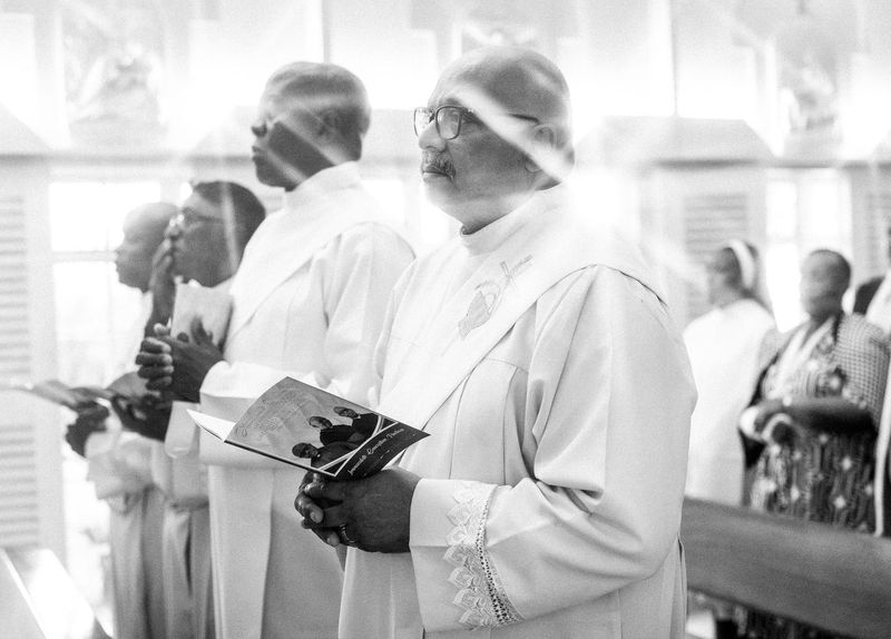 © Cole Ndelu - Priests present to support and bear witness to the ordination.
