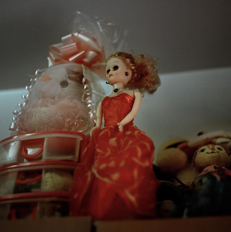© Ruth Prieto - A barbie doll stands on the shelve.