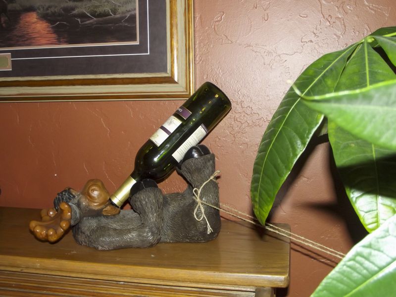 © Natalie Behring - Home decor, featuring a moose drinking a bottle of wine in Driggs, Idaho.