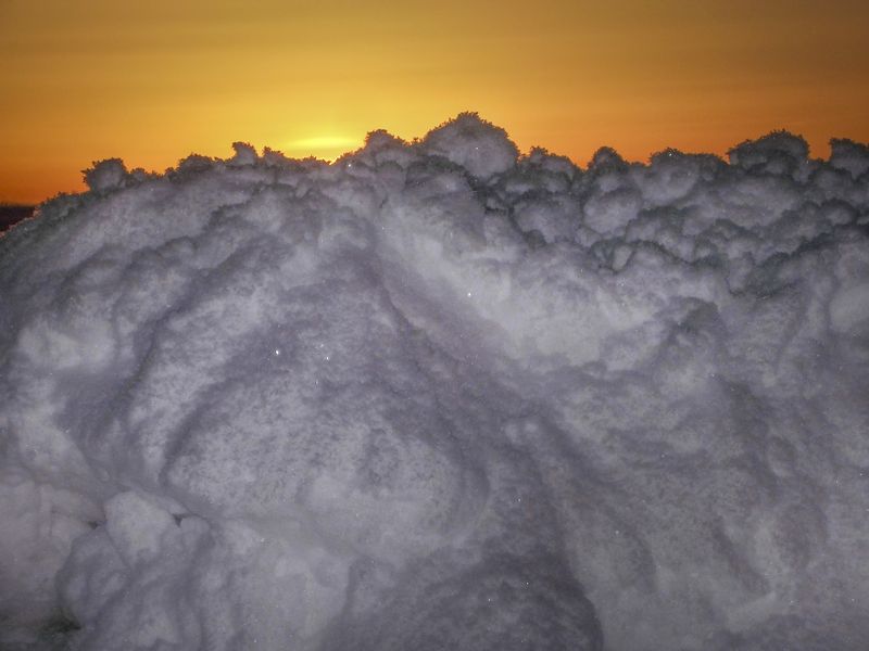 © Natalie Behring - Blue snow and yellow sky at sunset in Victor, Idaho.
