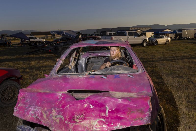 © Natalie Behring - A driver at a demolition derby in Driggs, Idaho.