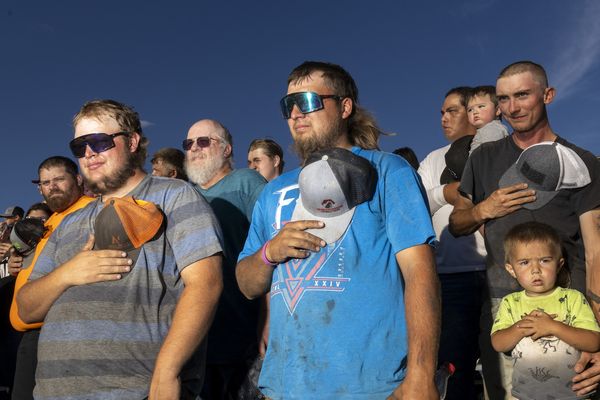 © Natalie Behring - Patriots during the national anthem at Figure 8 racing at the Teton County Fair in Driggs Idaho August 12, 2023.