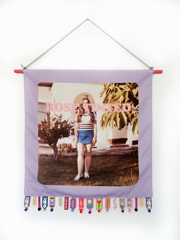 © Rossanne Pellegrino - Rose-tinted. Family photograph (artist's mother) printed on canvas with text and fuse bead fringe bead made by the artist.