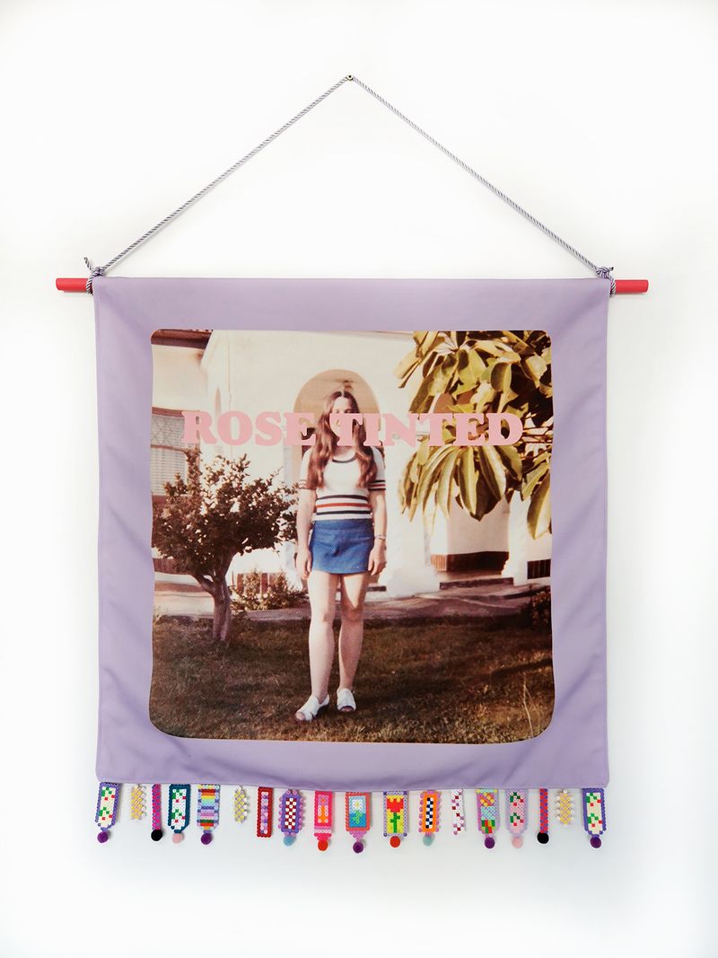 © Rossanne Pellegrino - Rose-tinted. Family photograph (artist's mother) printed on canvas with text and fuse bead fringe bead made by the artist.