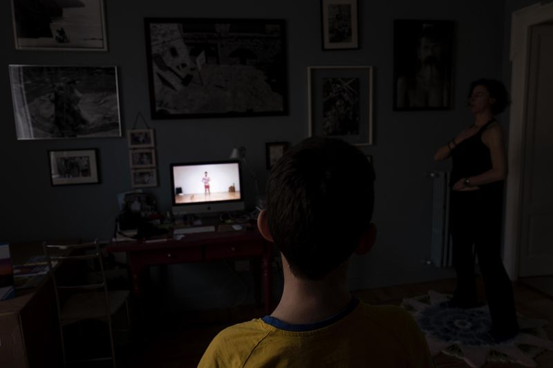 © Paolo Bona - Milano, March 15 2020Making a yoga lesson with a virtual master online.