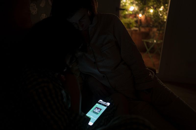© Paolo Bona - Milan, March 30, 2020My daughter Margherita, 9 years old, and my wife Paola, listen to an audiobook before going to sleep.