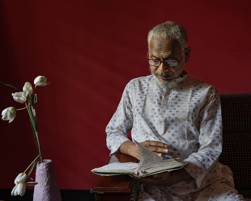 © Reyad Abedin - My father is reading an Islamic prayer book after lunch at my family's residence in Sonapur, Noakhali, Bangladesh.