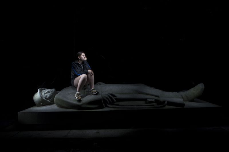 © Lara Wilde - A girl taking a rest at a monument from the second world war in the forest called Herzberg.