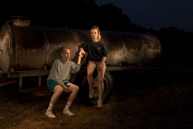 © Lara Wilde - A young couple looking after the horses, taking a rest at the water tank.