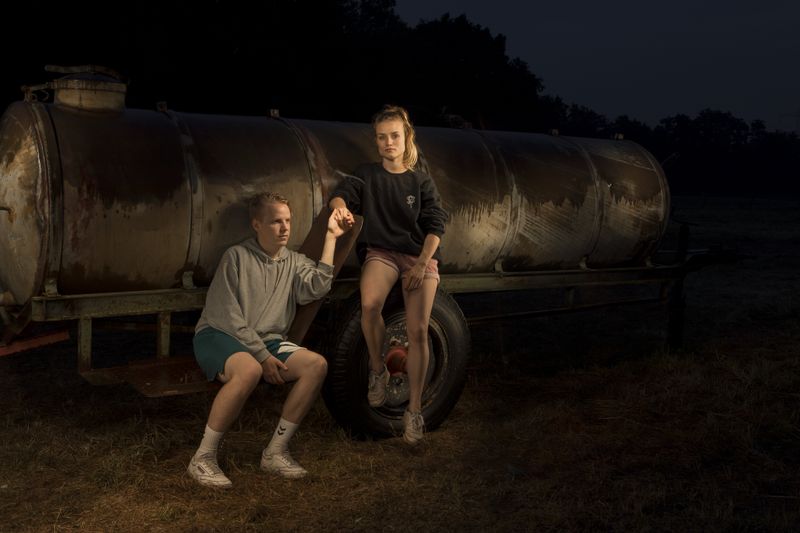 © Lara Wilde - A young couple looking after the horses, taking a rest at the water tank.