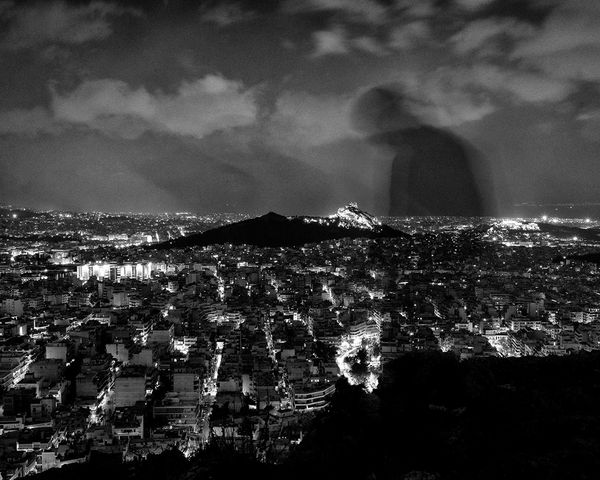 © Angelos Tzortzinis - A self portrait above the center of Athens on 26, on December 26, 2014.