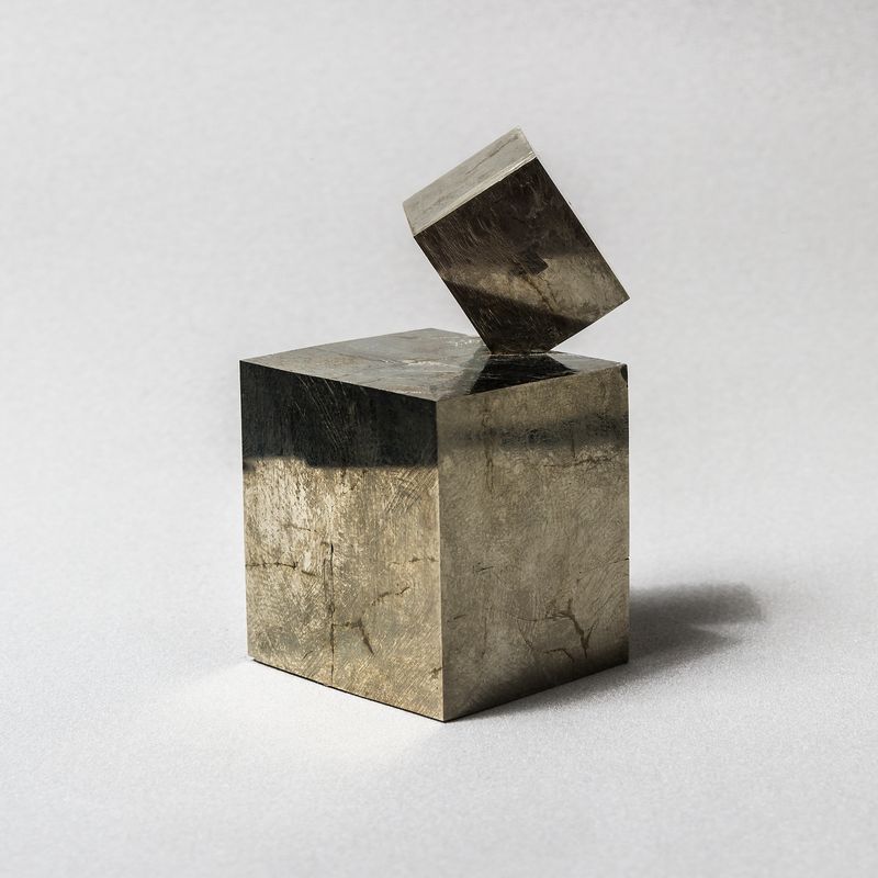 © Ilan Rabchinskey - Pyrite #1. Natural intersecting pyrite cubes from Navajun, Spain, with an estimated age of 130 million years.