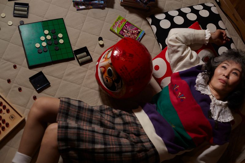 © Yuki Furusawa - Mother surrounded by children’s playthings.