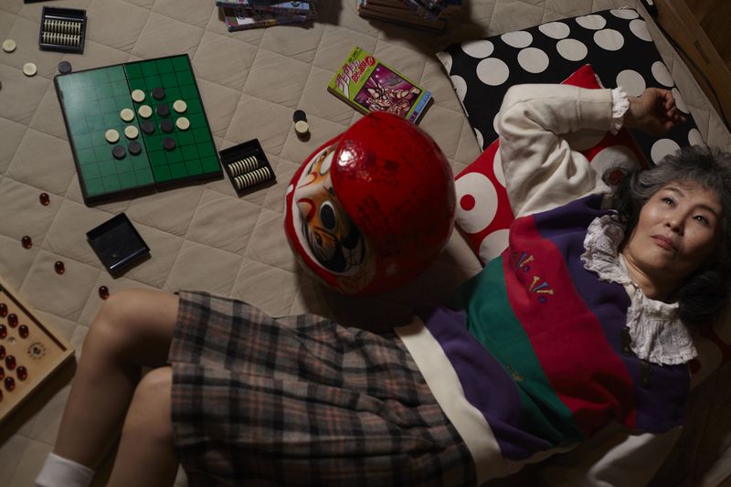 © Yuki Furusawa - Mother surrounded by children’s playthings.