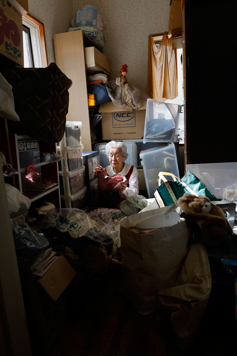 © Yuki Furusawa - My grandmother attempting to clear out her belongings, while reminiscing in her closet room.