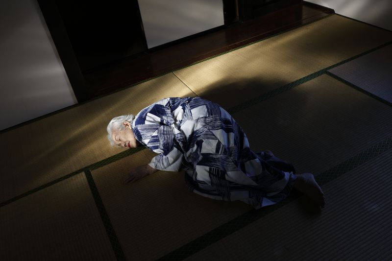 © Yuki Furusawa - My grandmother, lying on the floor in her old nightwear, reminiscing about memories tied to the house.