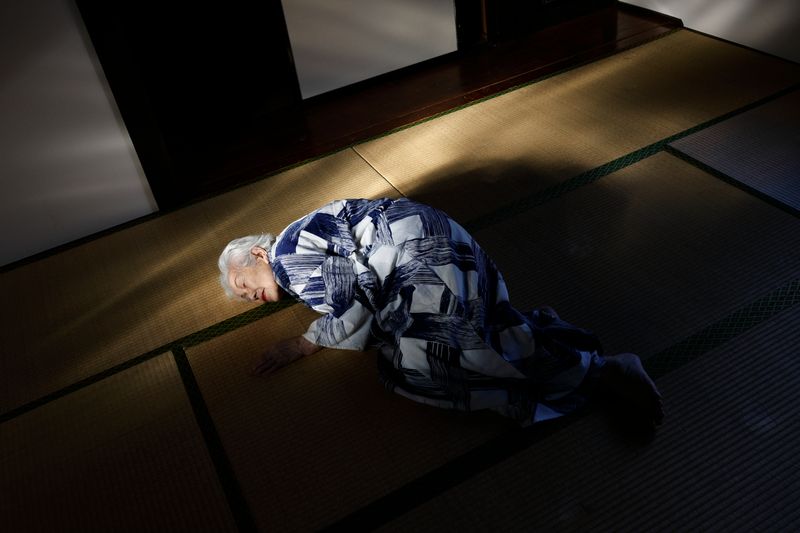 © Yuki Furusawa - My grandmother, lying on the floor in her old nightwear, reminiscing about memories tied to the house.