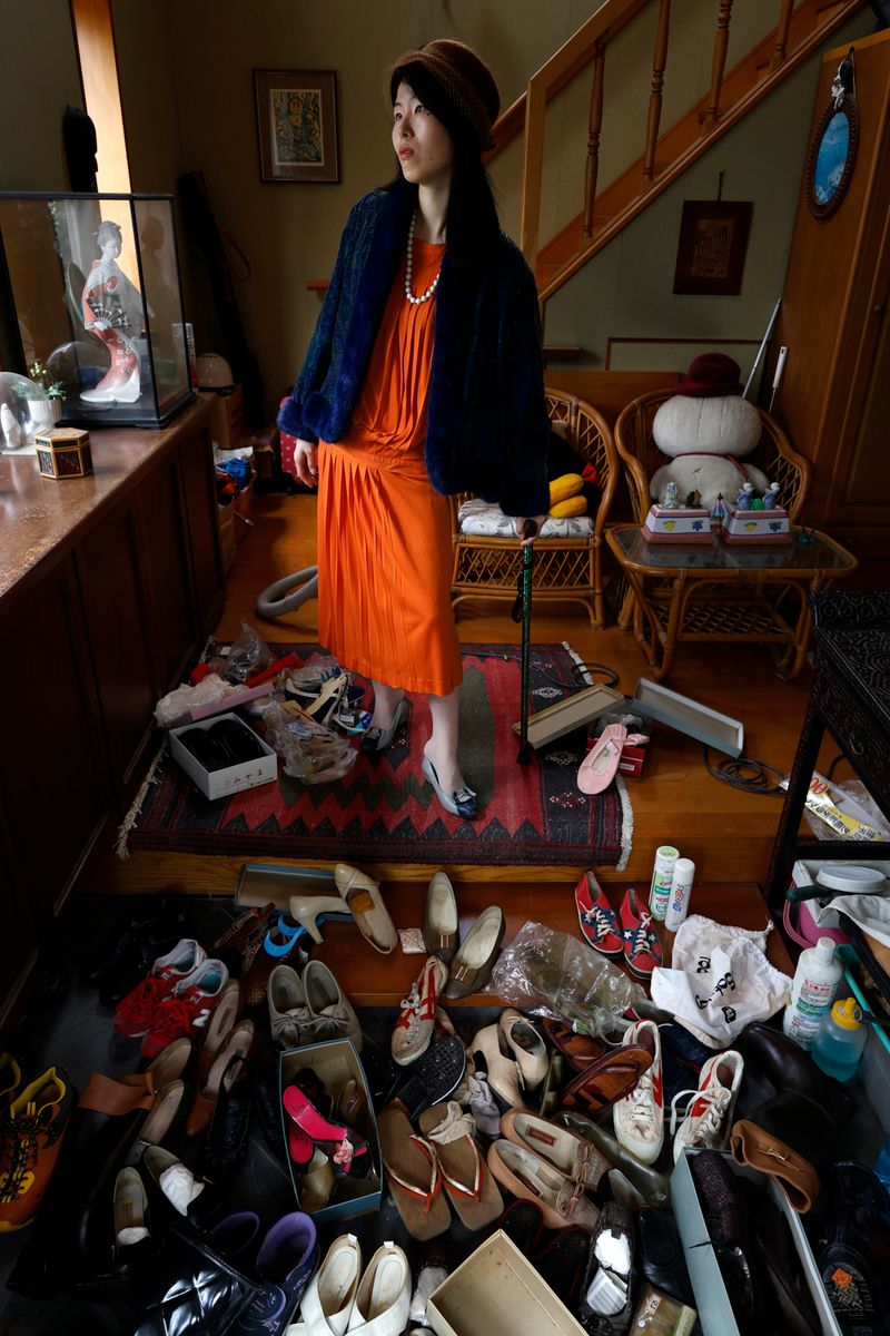 © Yuki Furusawa - Me wearing my grandmother’s favorite outfit from her youth, surrounded by shoes that would soon be thrown away.
