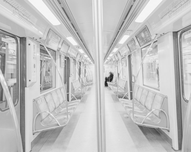 © Tomasz Lazar - An elderly man at high risk, occupying a secluded place in a subway car. Warsaw, Poland, 19.03.2020