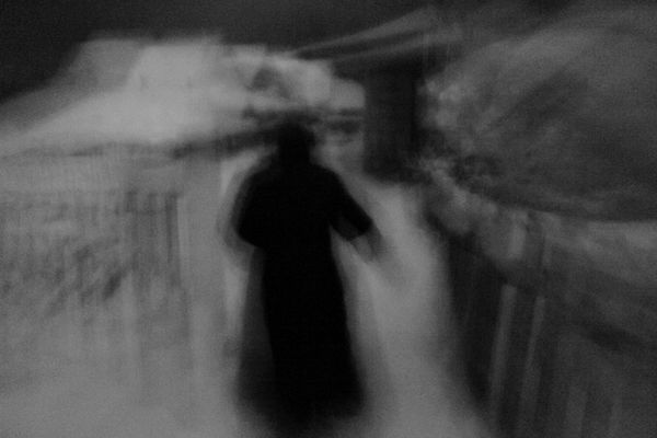 © Kuba Kaminski - Whisperer from Okriabr village, Belarus in front of her house.