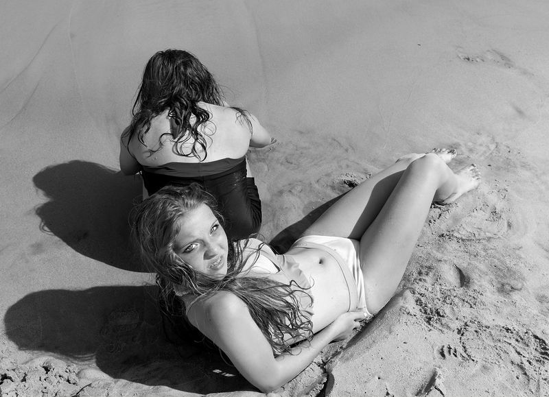 © Mary-Louise Miller - Red.  Teenage sunbather at Myrtle Beach, SC. © ML Miller
