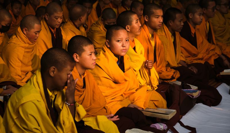 © Takshak Parmar - Young monks sit in for early morning prayer at the Bodhi temple complex | Bodh Gaya, India