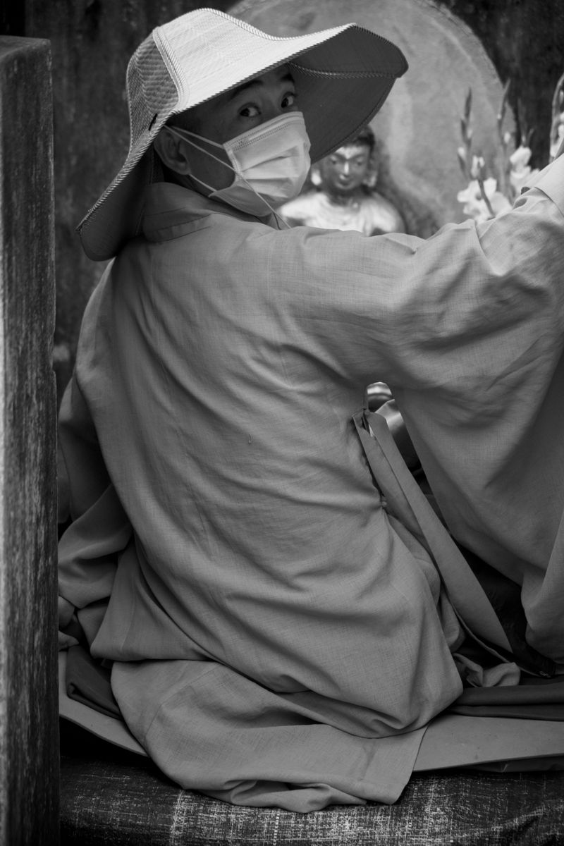 © Takshak Parmar - A Vietnamese monk in front of a Buddha statue preparing to start meditations for the day | Bodh Gaya, India