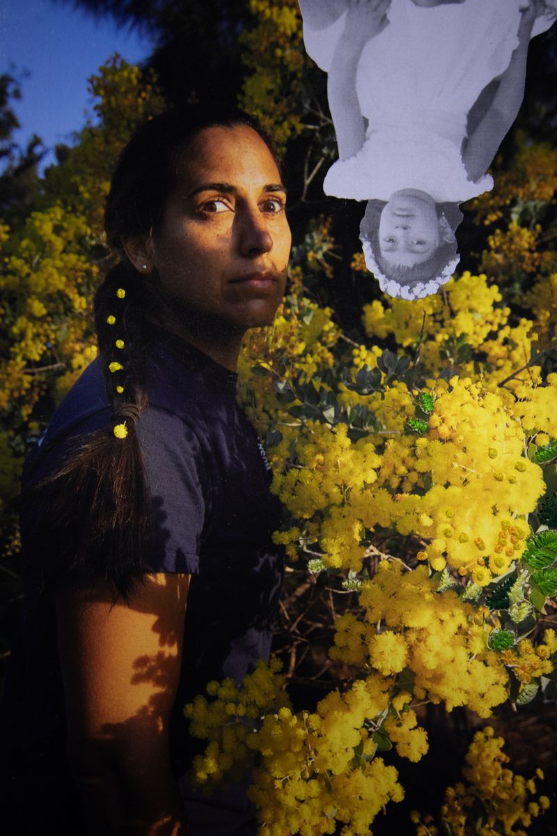 © Davina Jogi - 'Brown Gilt'. Self-portrait with the golden wattle, Bridgetown, Western Australia, 2022. (Embroidered Photographic Collage)