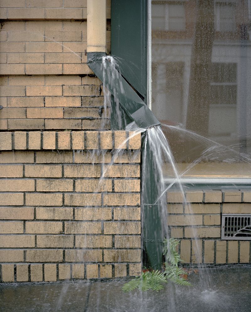 © Justin Maxon - A busted drain spout is seen during a heavy rain storm in Eureka.
