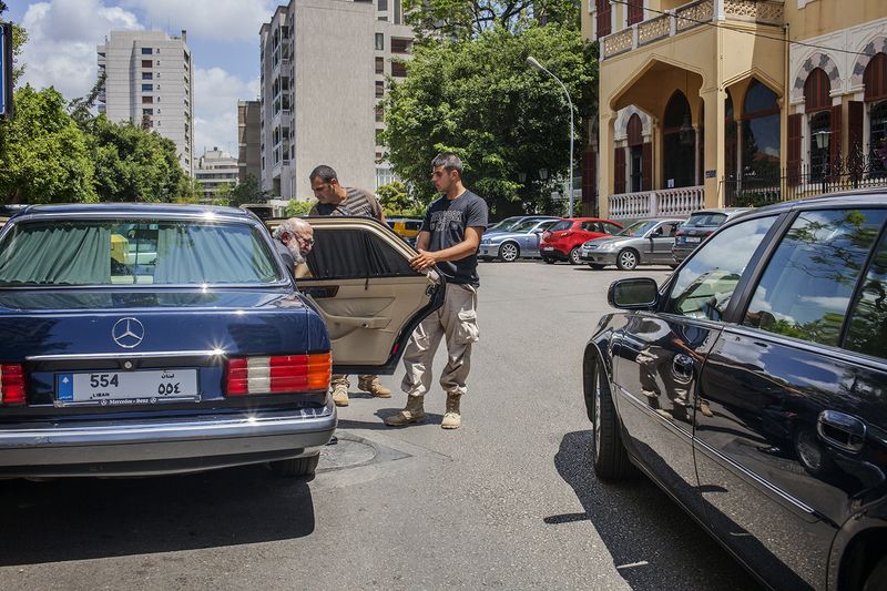 © Anna Bosch - Roger Eddé with two of his private security guards
