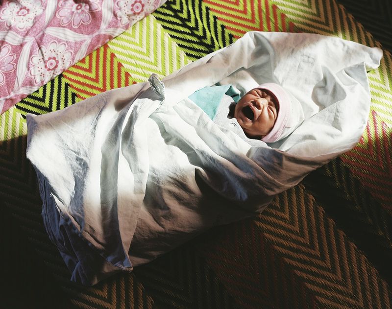 © Annie Ling - Zayid, 3-days-old. His father and 4-years-old brother went for haircuts nine months ago in Aleppo and never returned home.