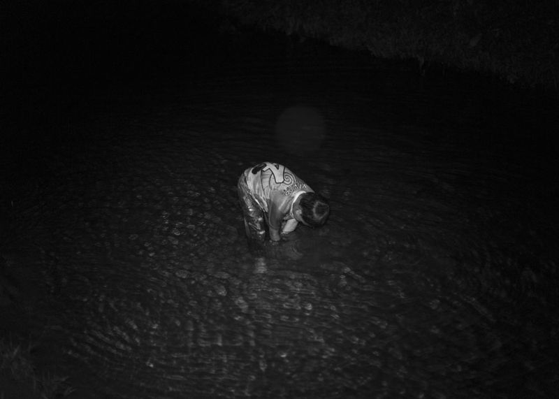 © Daniela Beltran B. - Ismael, Naime's son taking a quick late-shower in the river next to their house.