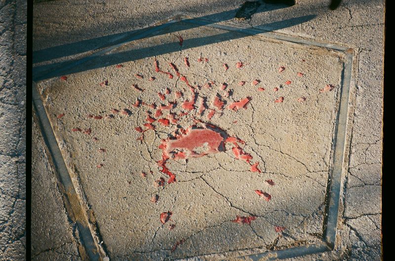 © Chiara Kurtovic - A trace of a grenade, painted in red, to mark and make it visible so we don't forget the past