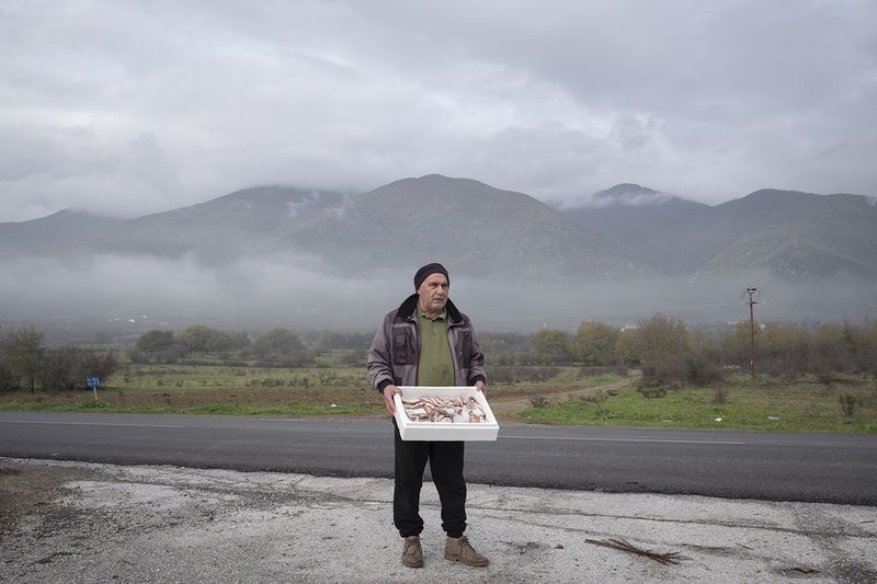 © dimitris rapakousis - Man fishing in Lake Kerkini, in order to sell his catch to the residents living on the Greek-Bulgarian border.