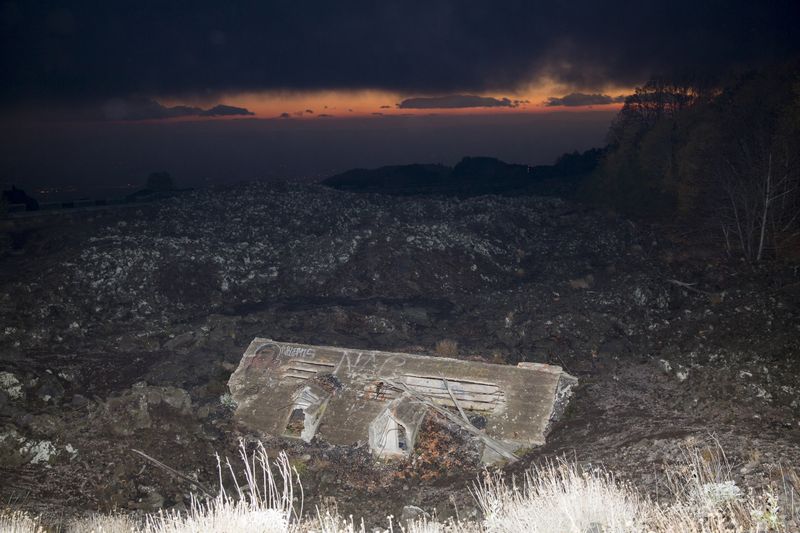 © Gaia Squarci. A house submerged by lava is seen on mount Etna, Sicily. 2015