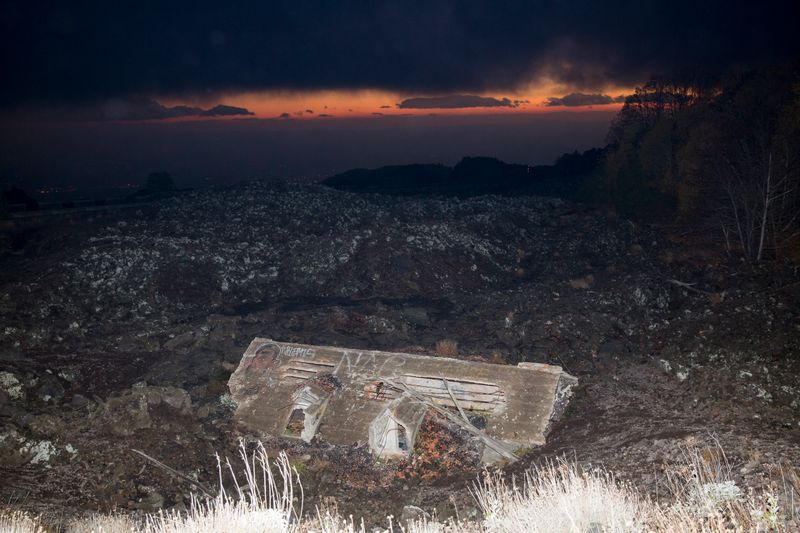 © Gaia Squarci. A house submerged by lava is seen on mount Etna, Sicily. 2015