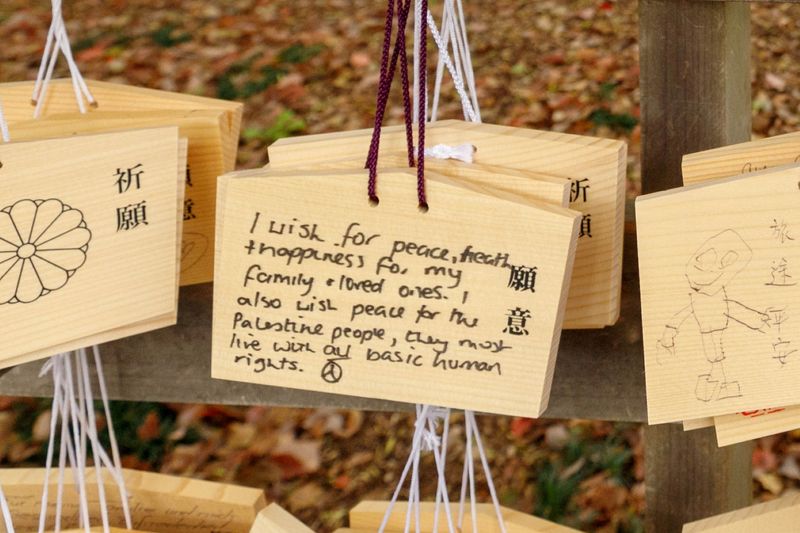 © ROBERTA LODI - "Message of Peace"       Wooden votive tablets with personal prayers, including a message calling for peace.