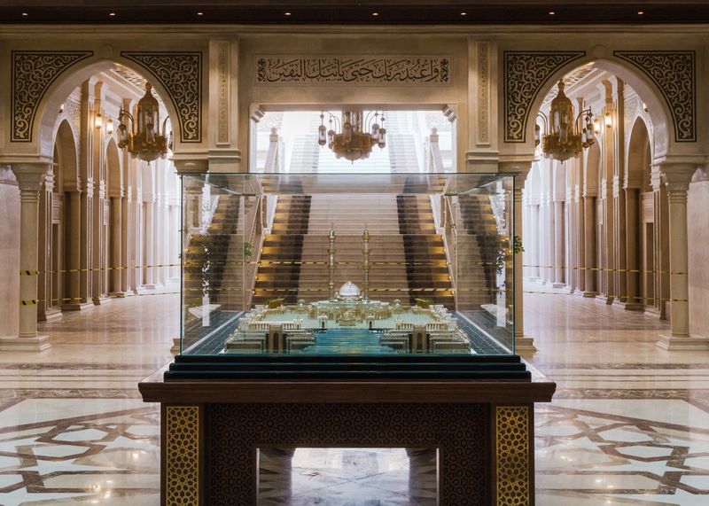 © Louis Roth - Masjid Misr Model - A shiny glass model is held inside a part of the grand mosque that is yet restricted to visitors.