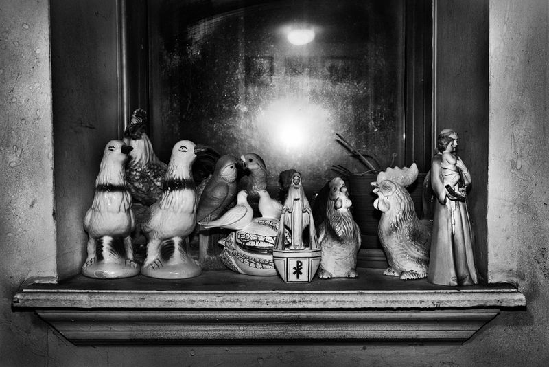 © Bastien Deschamps - Statues inside 2tone’s father’s apartment in East New York, May 27th 2019. “For some of us it’s a religion”.