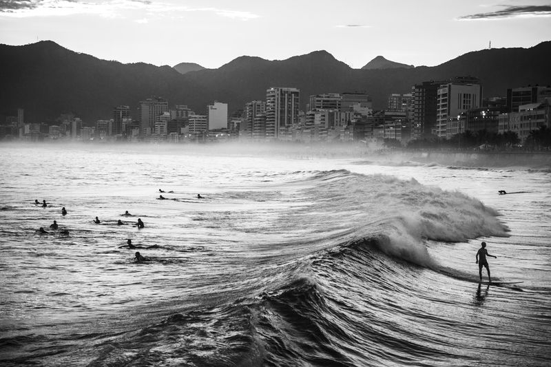 © João Pina - A man rides a wave at Arpoador beach, Ipanema, southern Rio de Janeiro. April 2016.