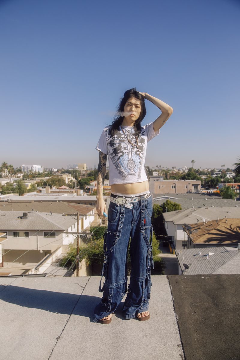 © Leafy Yun Ye - Roxxy vapes on her apartment rooftop in Central Los Angeles, 2023.