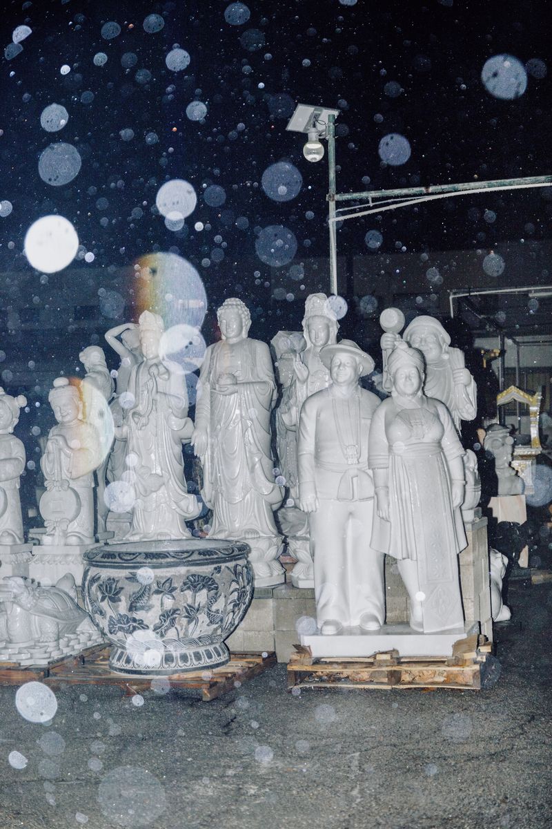 © Leafy Yun Ye - A collection of white stone sculptures in the rain, Los Angeles, 2025.