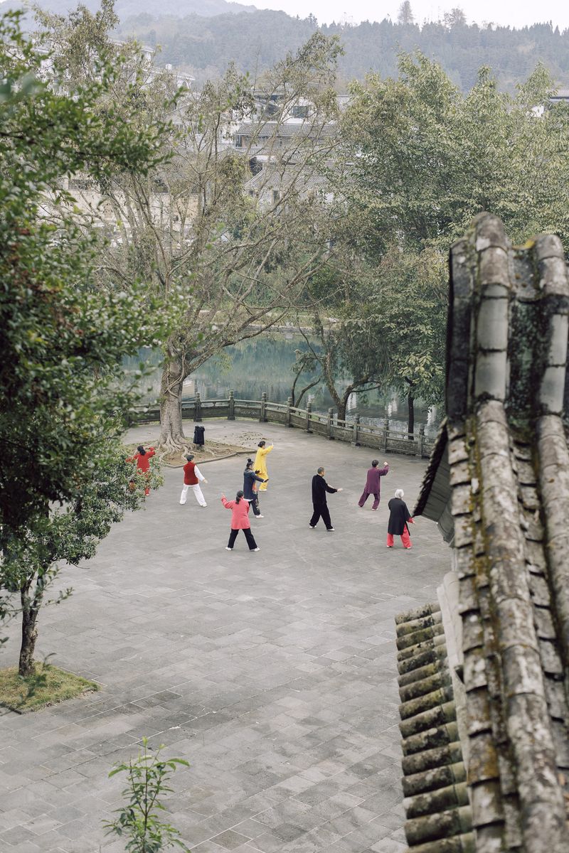 © Leafy Yun Ye - A group of residents practice Taichi in the morning, Tengchong, China, 2023.